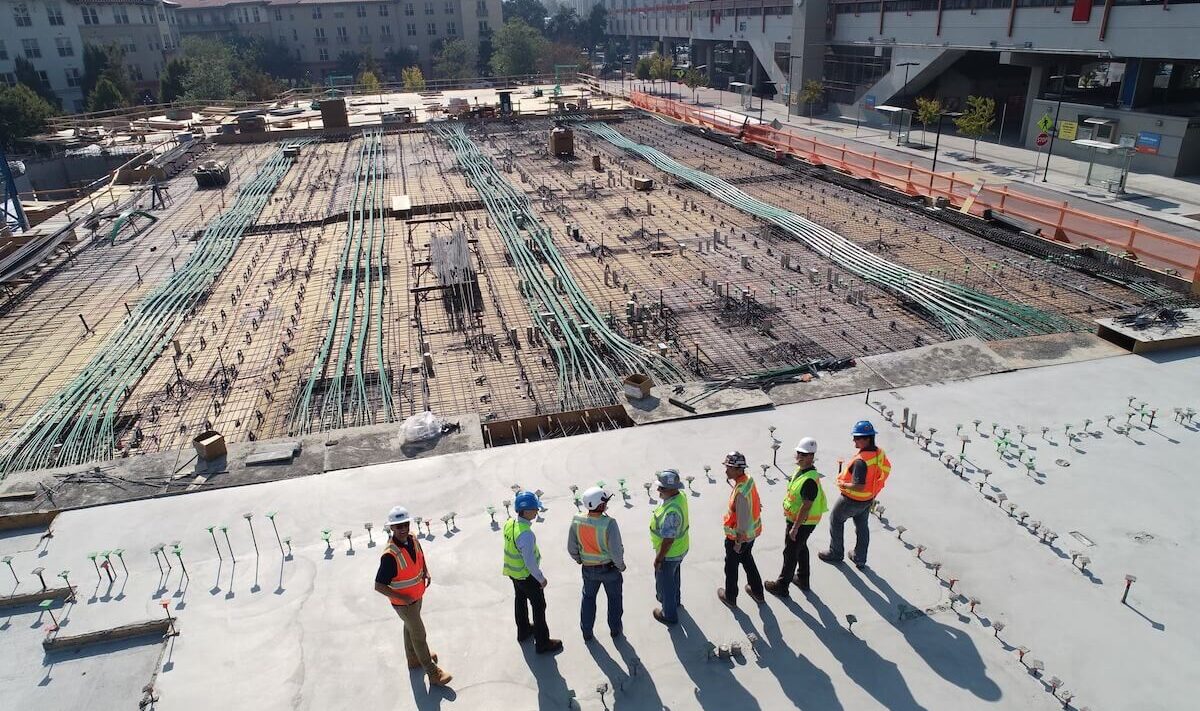Construction team reviewing a building site